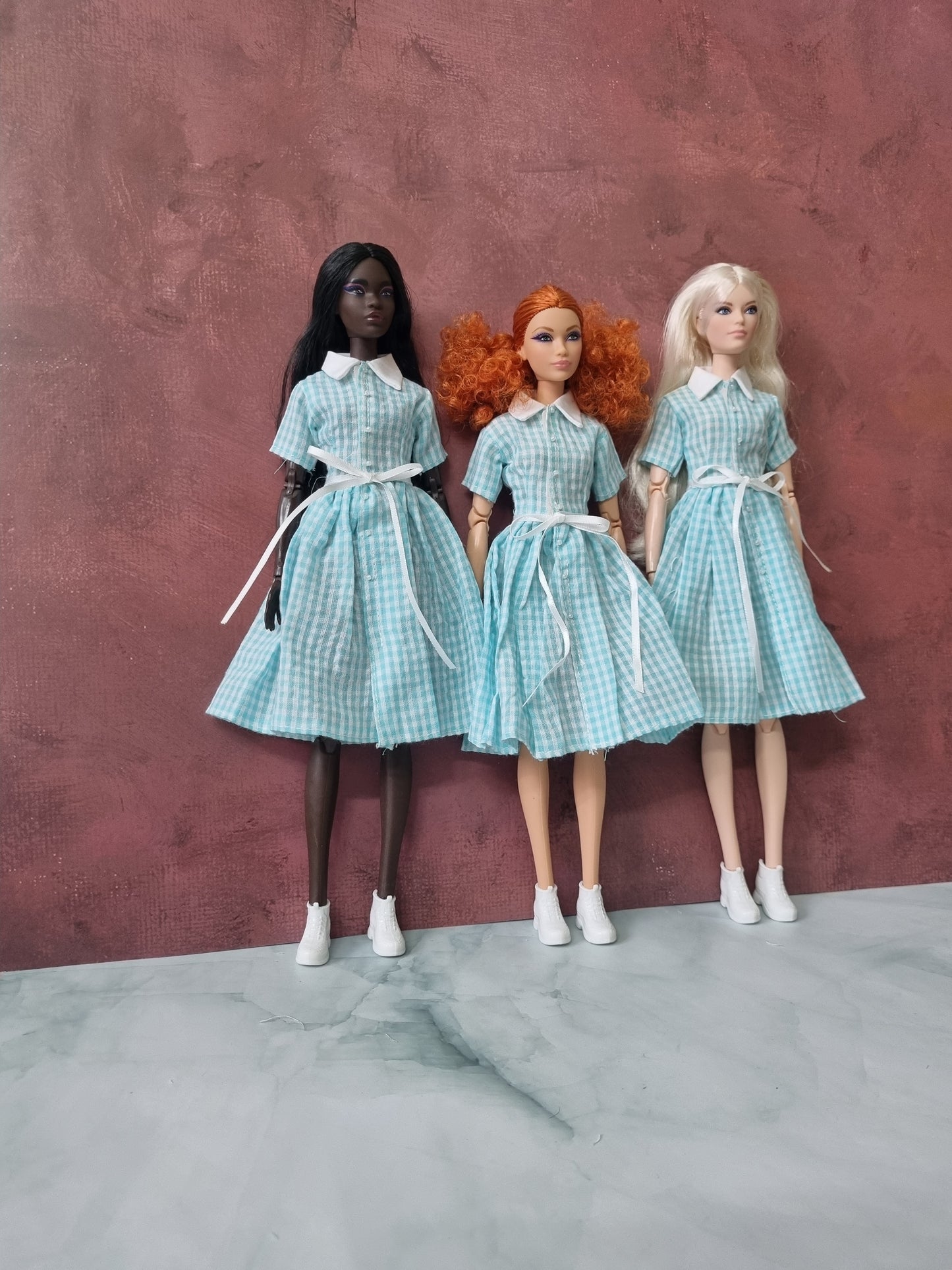 three barbie wear dress