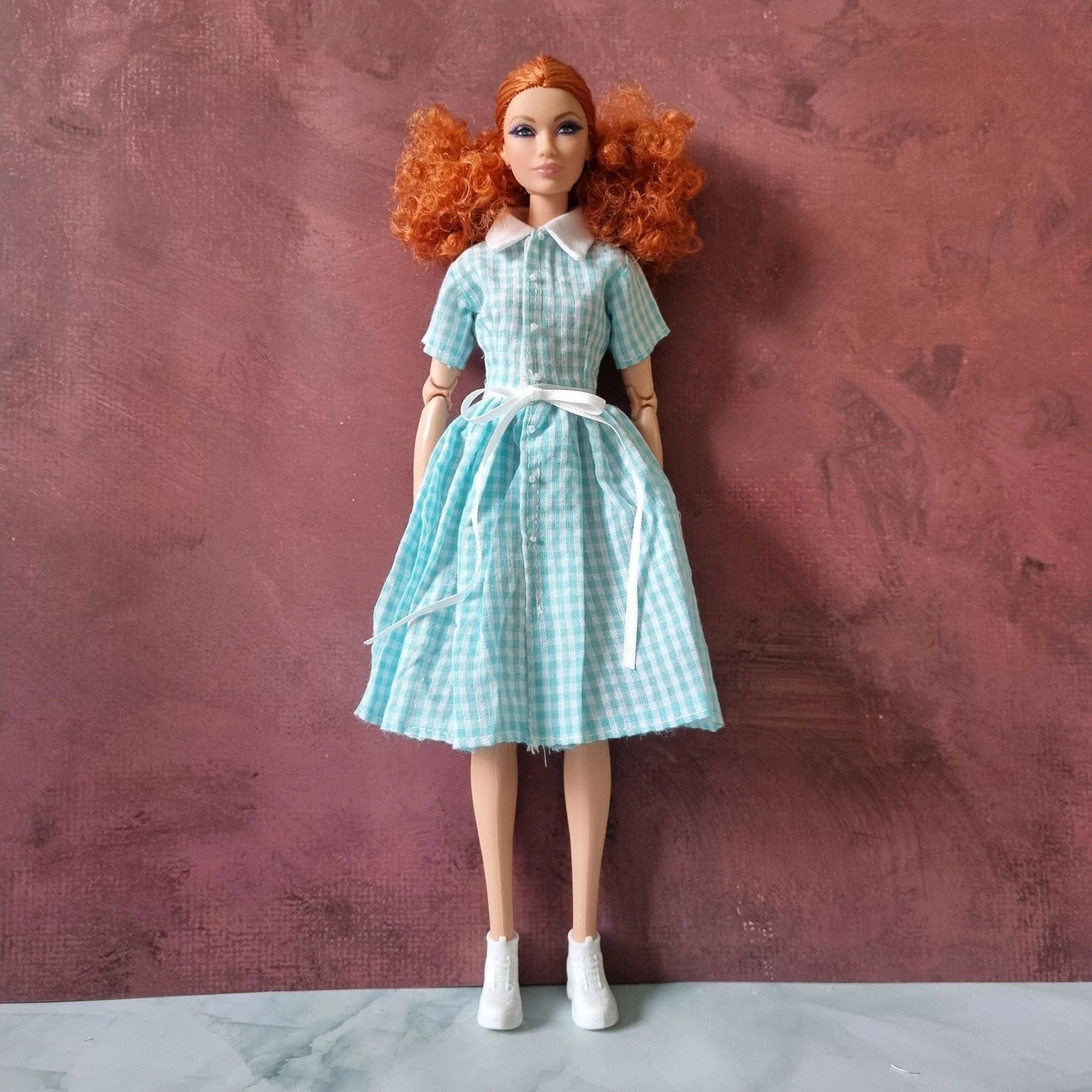 Barbie doll in vintage blue gingham shirt dress with white collar and waist tie
