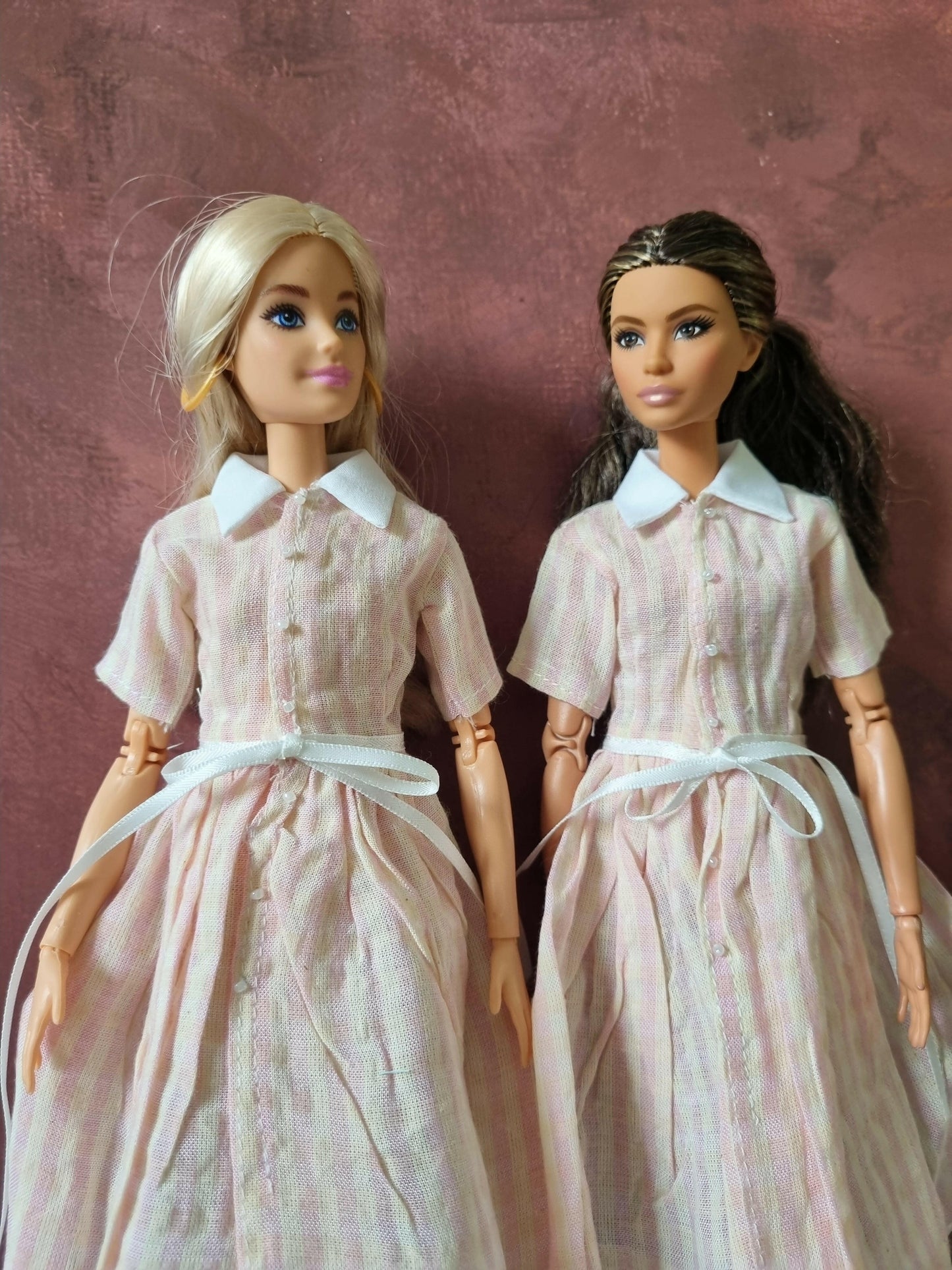 two barbie wear pink dress