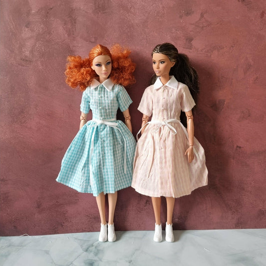 two barbie wear dress