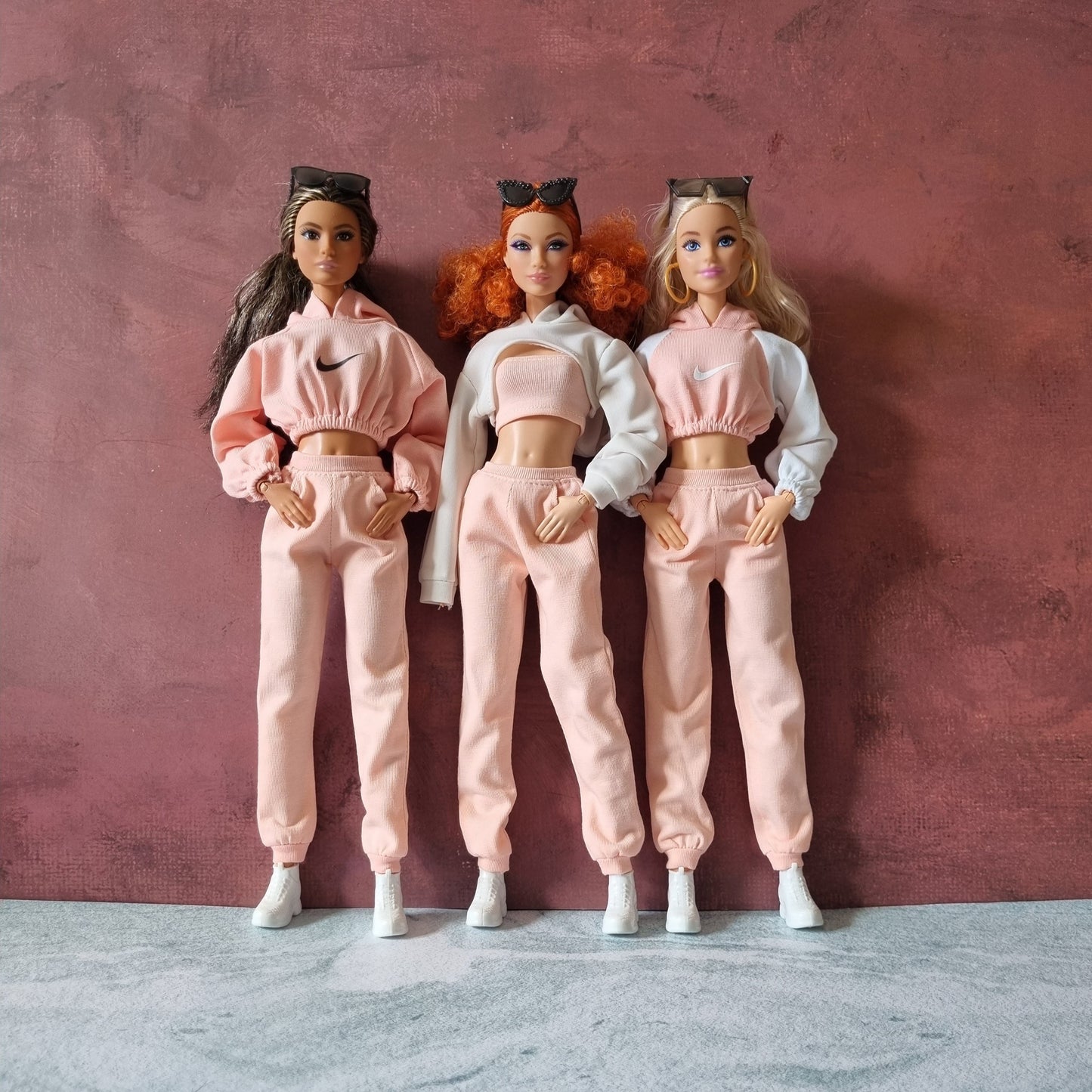 three barbie with oufit
