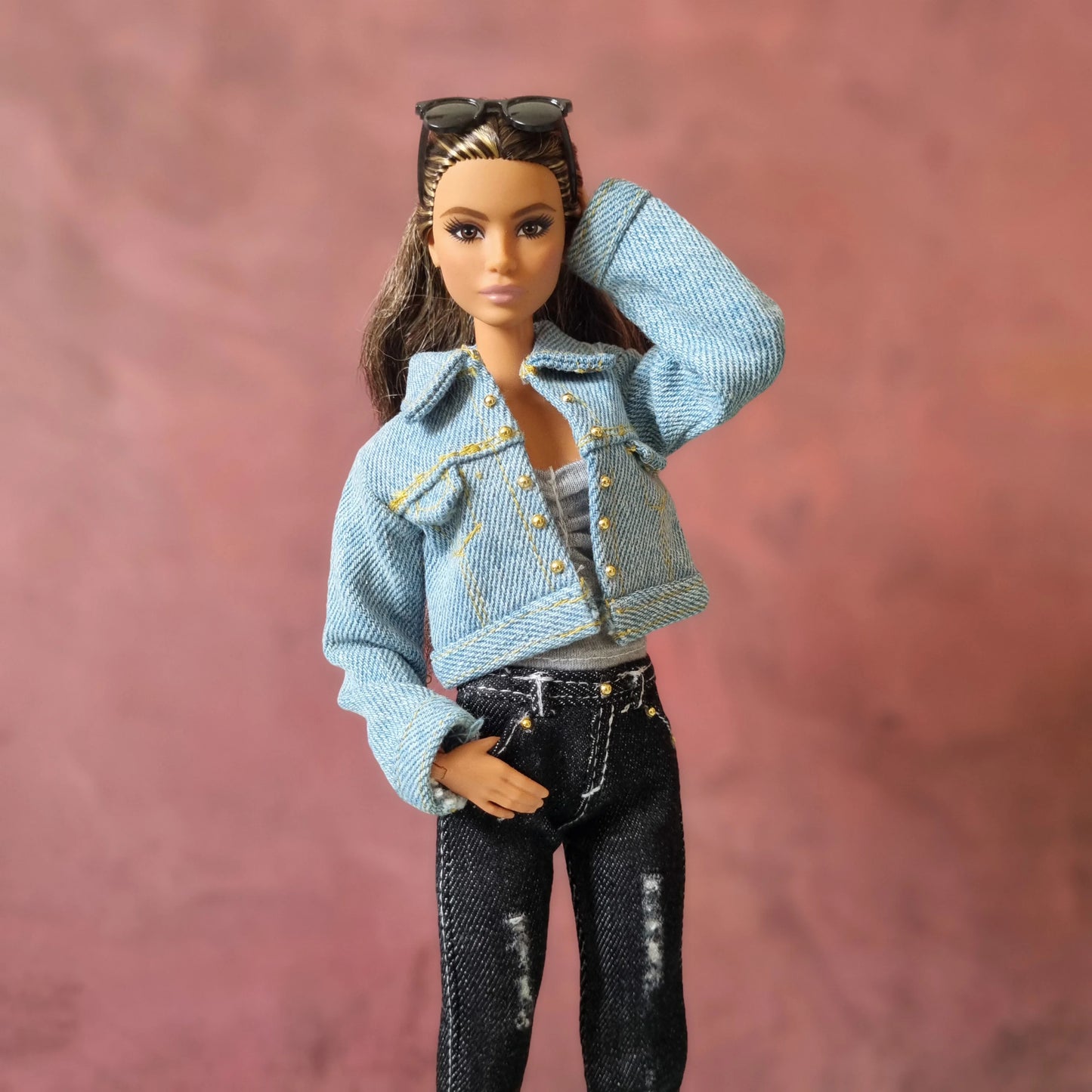 Casual chic Barbie doll outfit featuring a studded light blue denim jacket and black distressed jeans.