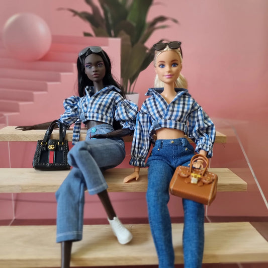 Fashion dolls wearing stylish blue gingham check tops and blue jeans casual outfits.