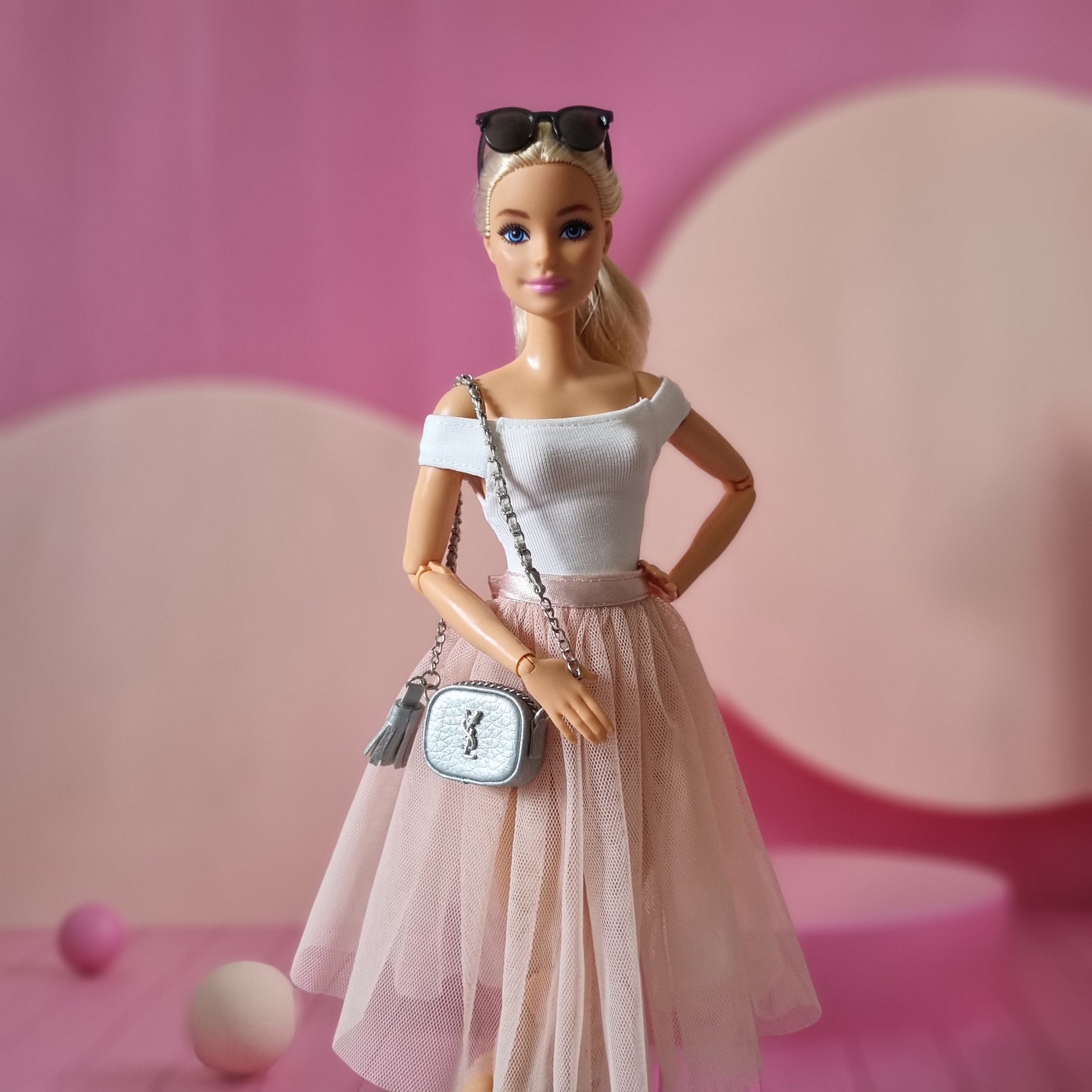 Barbie with white top , skirt and hand bag