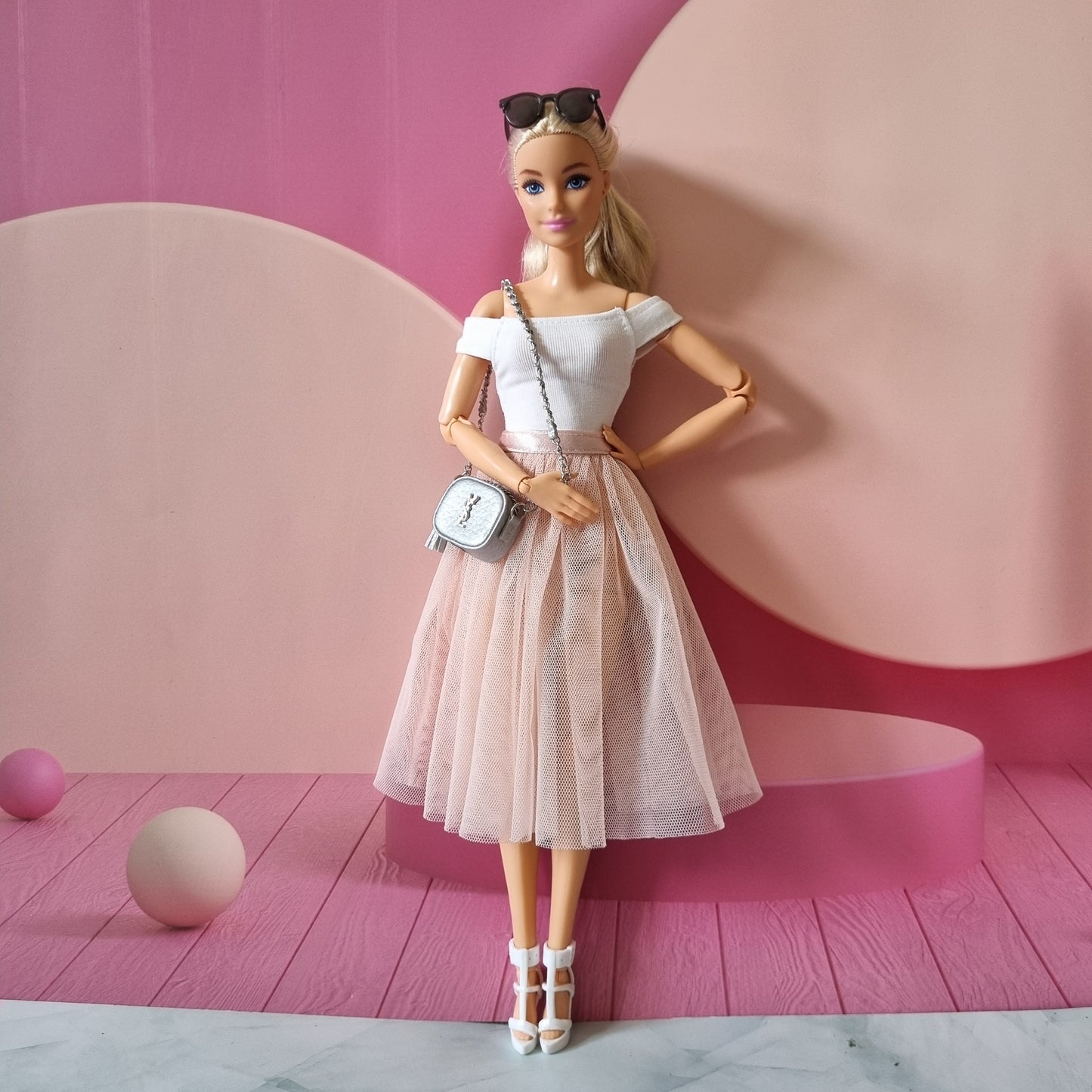 Barbie with white top , skirt and hand bag