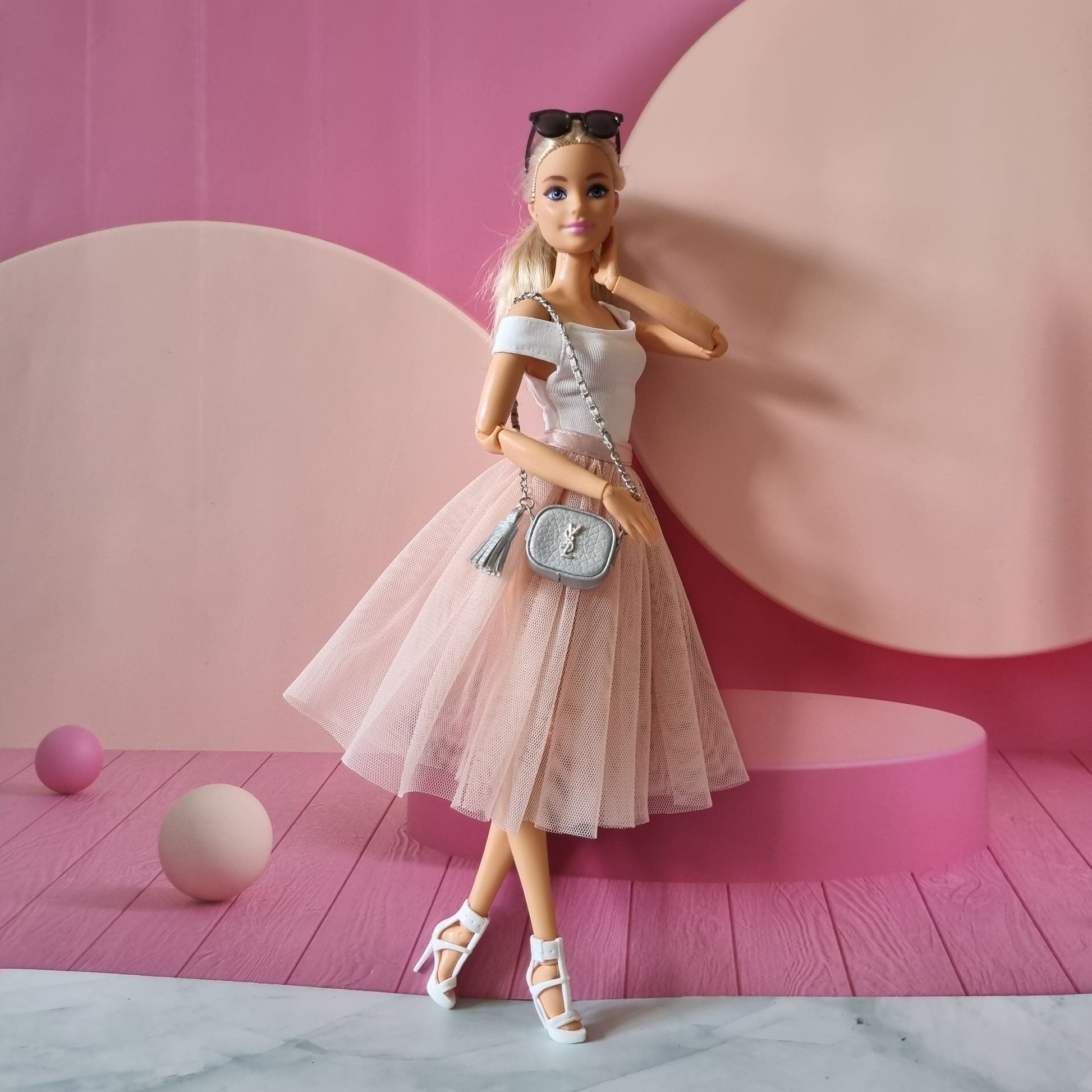 Barbie with white top , skirt and hand bag