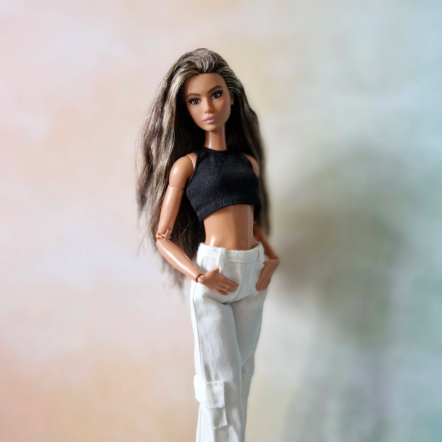 Black crop top and white cargo pants with side pockets and elastic cuffs for Barbie doll