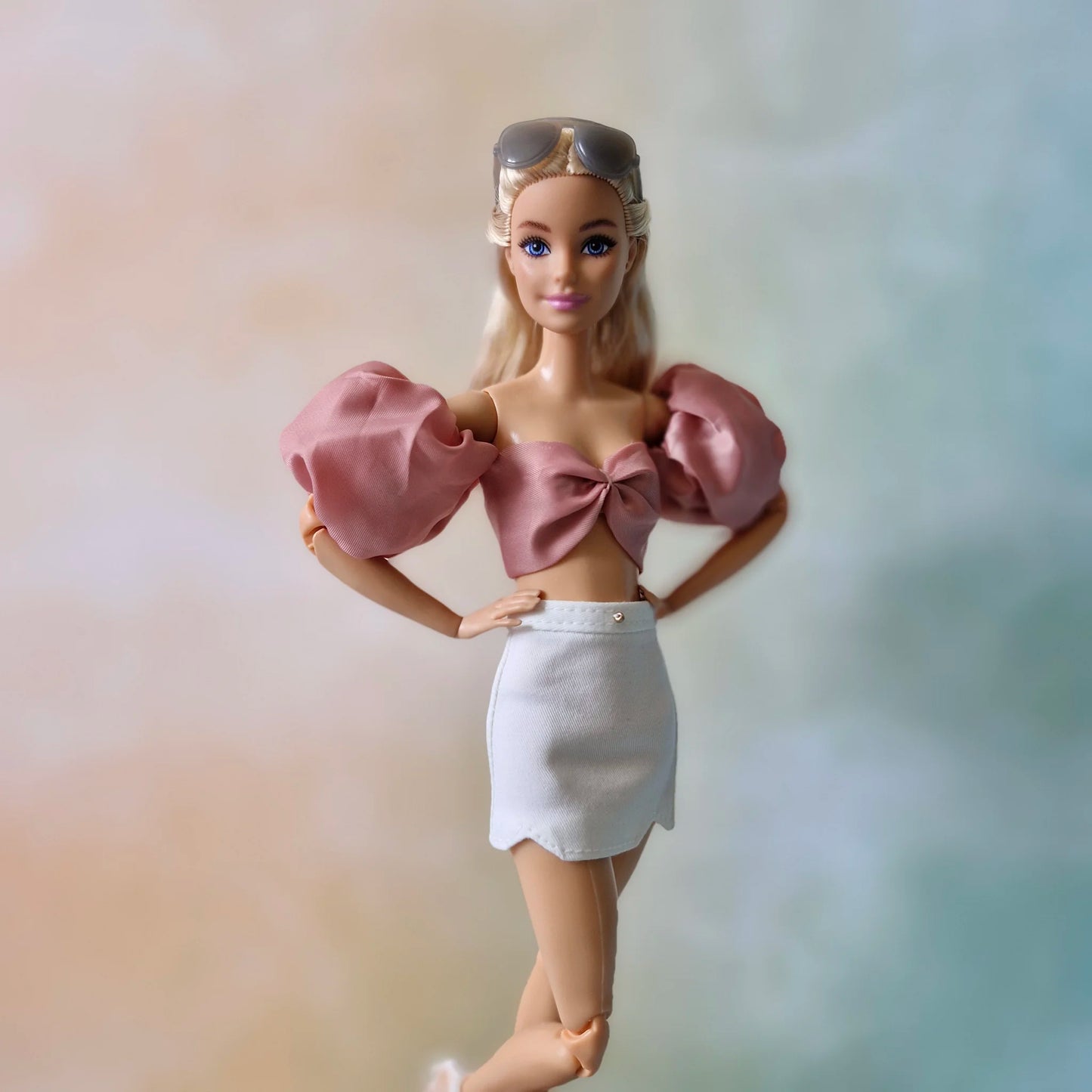 Crop top and white mini skirt for Barbie doll.