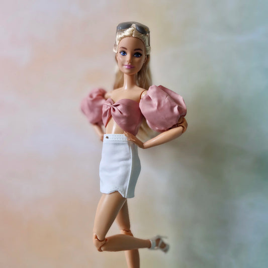 Crop top and white mini skirt for Barbie doll.