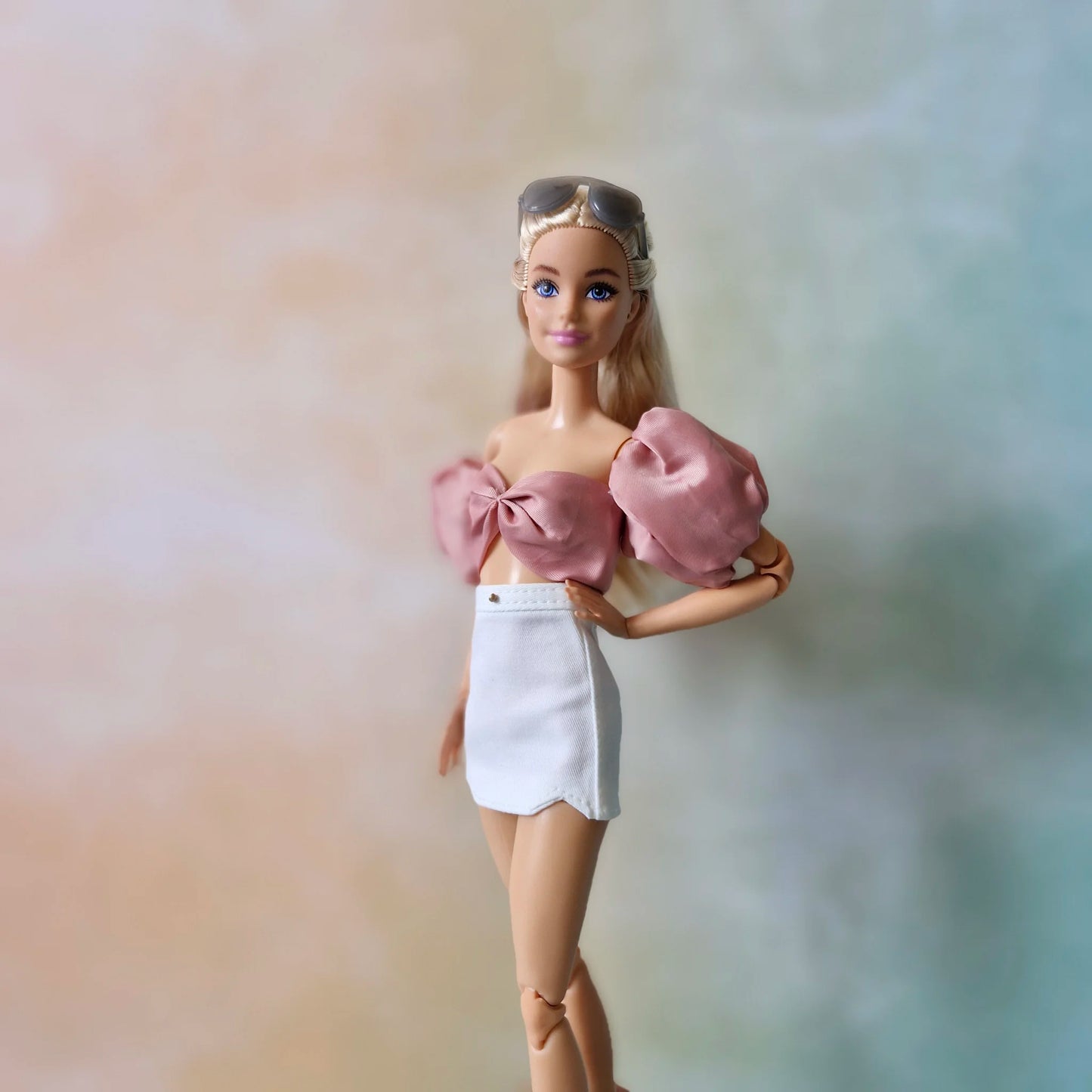 Crop top and white mini skirt for Barbie doll.