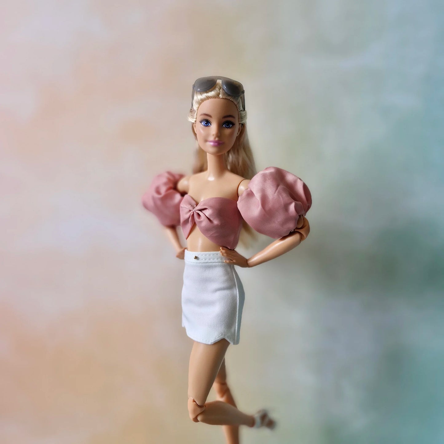 Crop top and white mini skirt for Barbie doll.