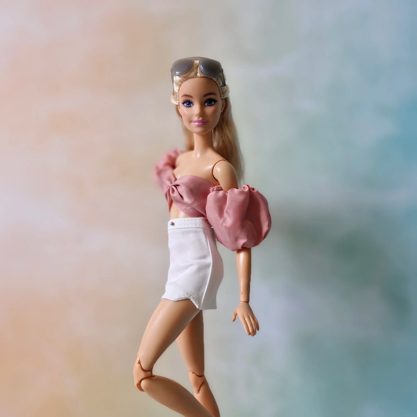 Crop top and white mini skirt for Barbie doll.