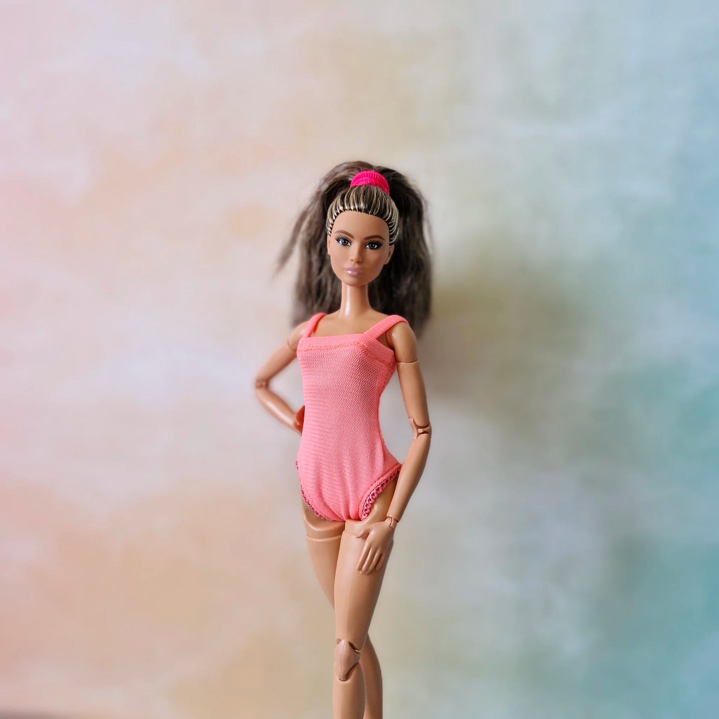 Barbie doll standing in handmade pink ballet leotard practice bodysuit