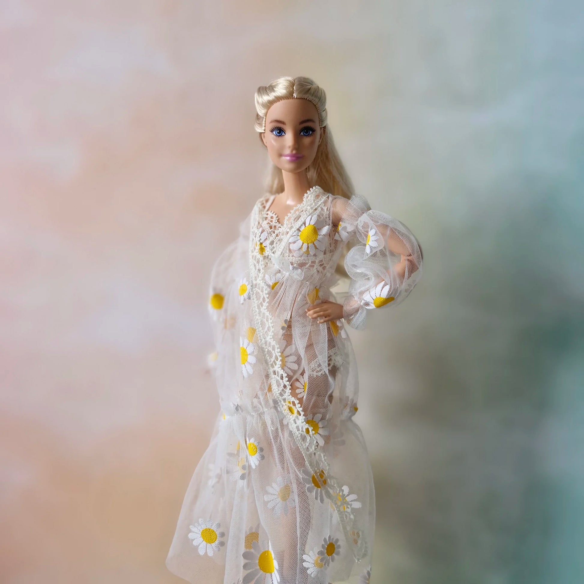 Close up Barbie doll in sheer daisy robe with lace trim, hand on hip pose