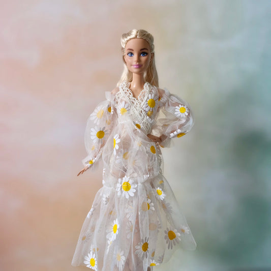 Front view Barbie doll wearing sheer daisy robe outfit, hand on hip
