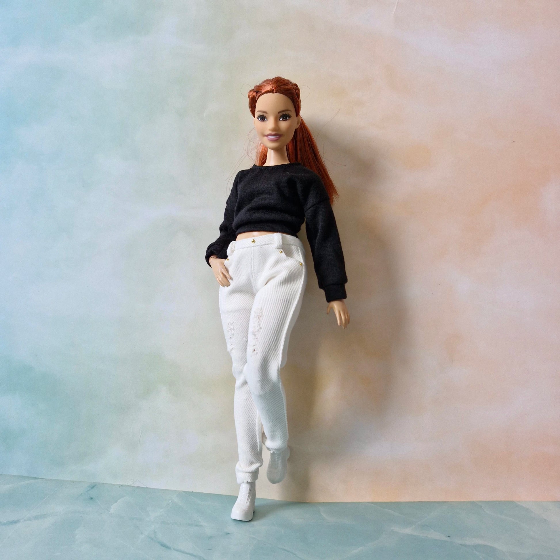 Curvy Barbie doll in white t-shirt and light blue acid wash jeans