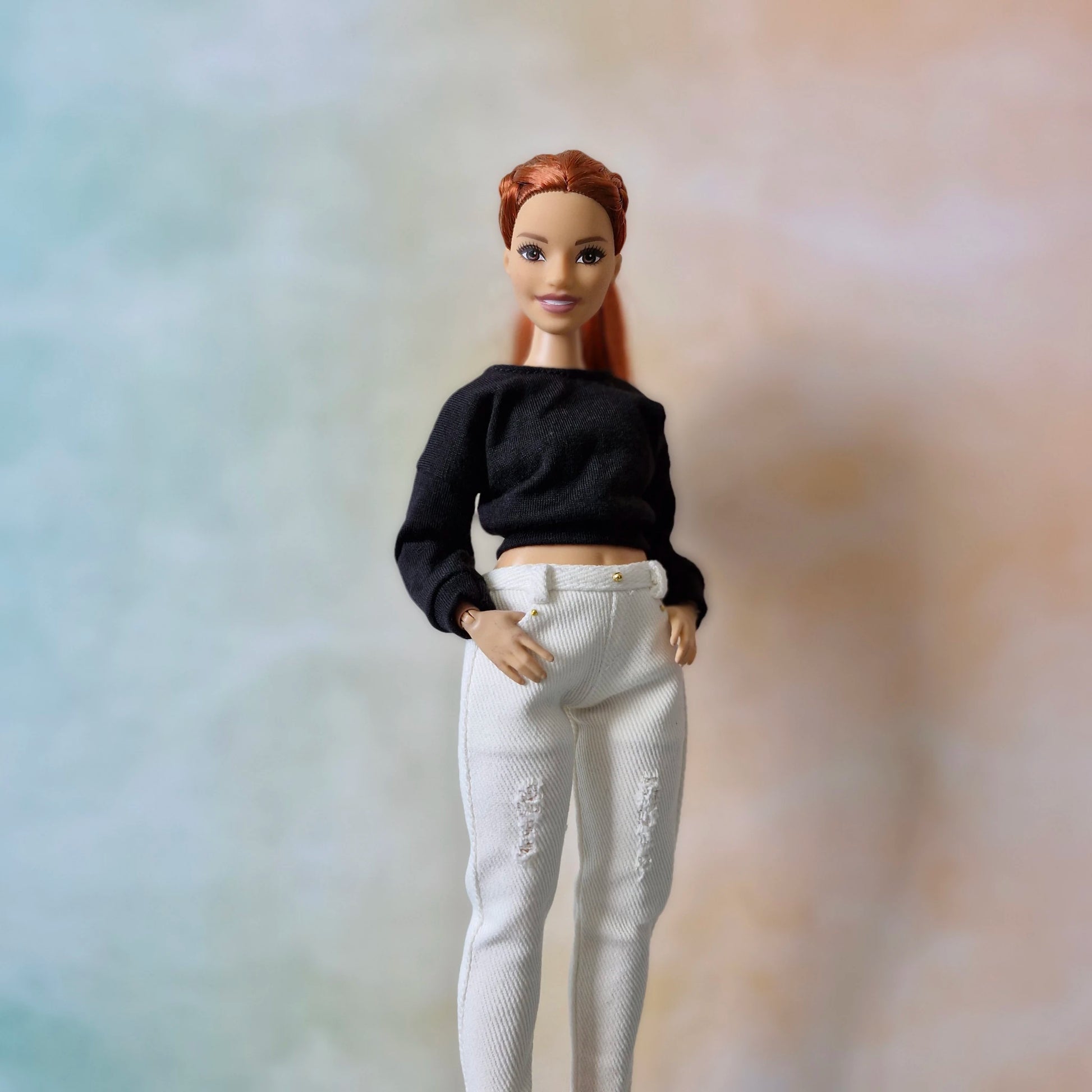 Curvy Barbie fashion doll wearing casual white top and stylish blue jeans