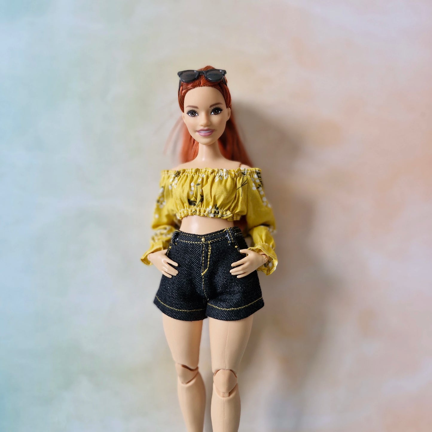 Front view of the handmade yellow top and black shorts set for Curvy Barbie dolls.