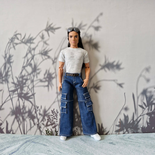 Ken doll wearing a heather grey t-shirt and wide leg blue denim cargo pants