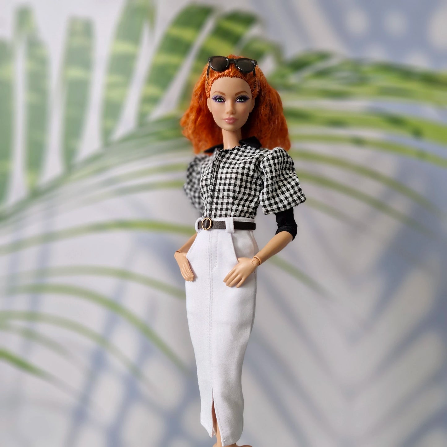 Elegant clothes for Barbie showing a gingham puff-sleeve top paired with a belted white pencil skirt.