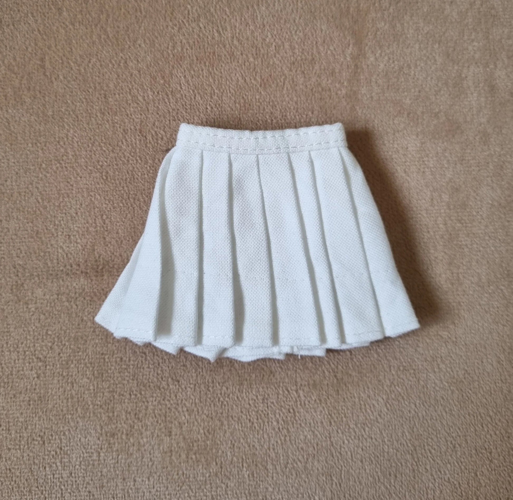 white pleated skirt for Barbie doll