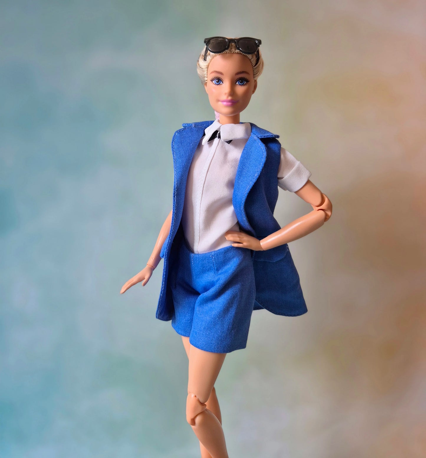 Blue sleeveless blazer, blue bra and short sets for Barbie doll.