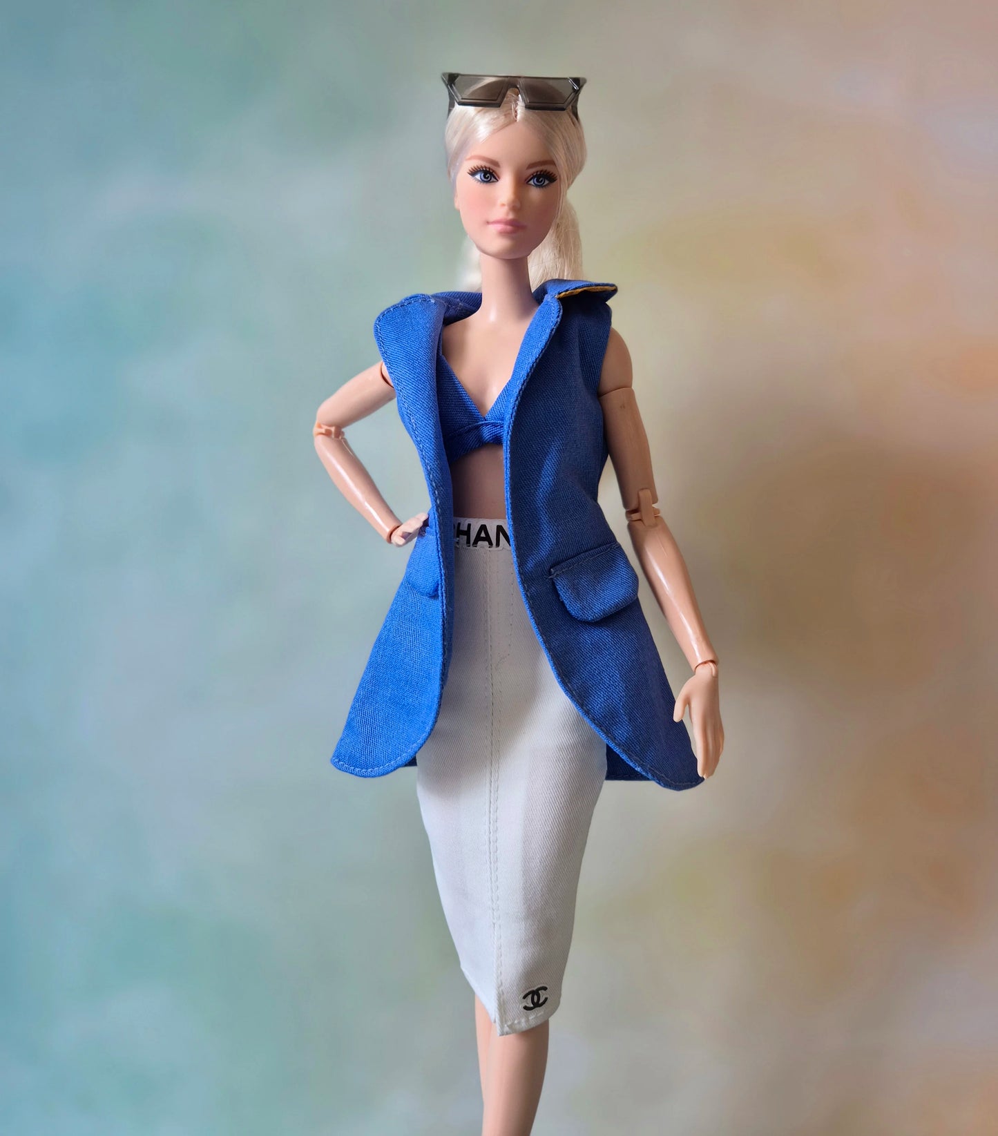 Blue sleeveless blazer, blue bra and short sets for Barbie doll.