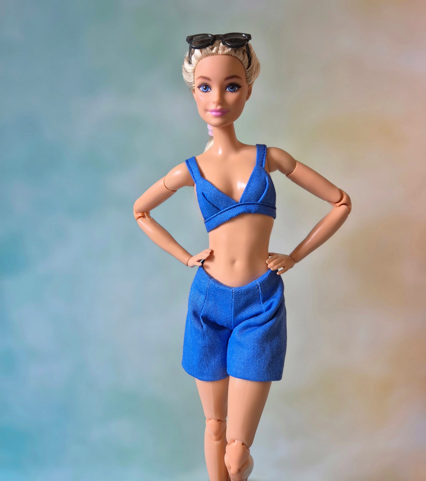 Blue sleeveless blazer, blue bra and short sets for Barbie doll.