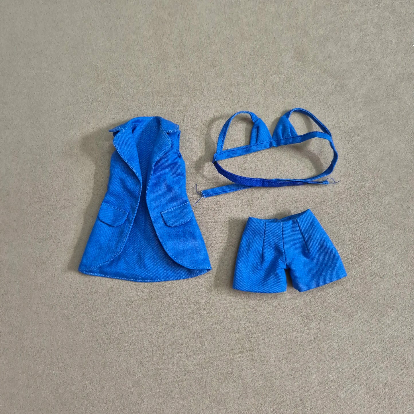 Blue sleeveless blazer, blue bra and short sets for Barbie doll.