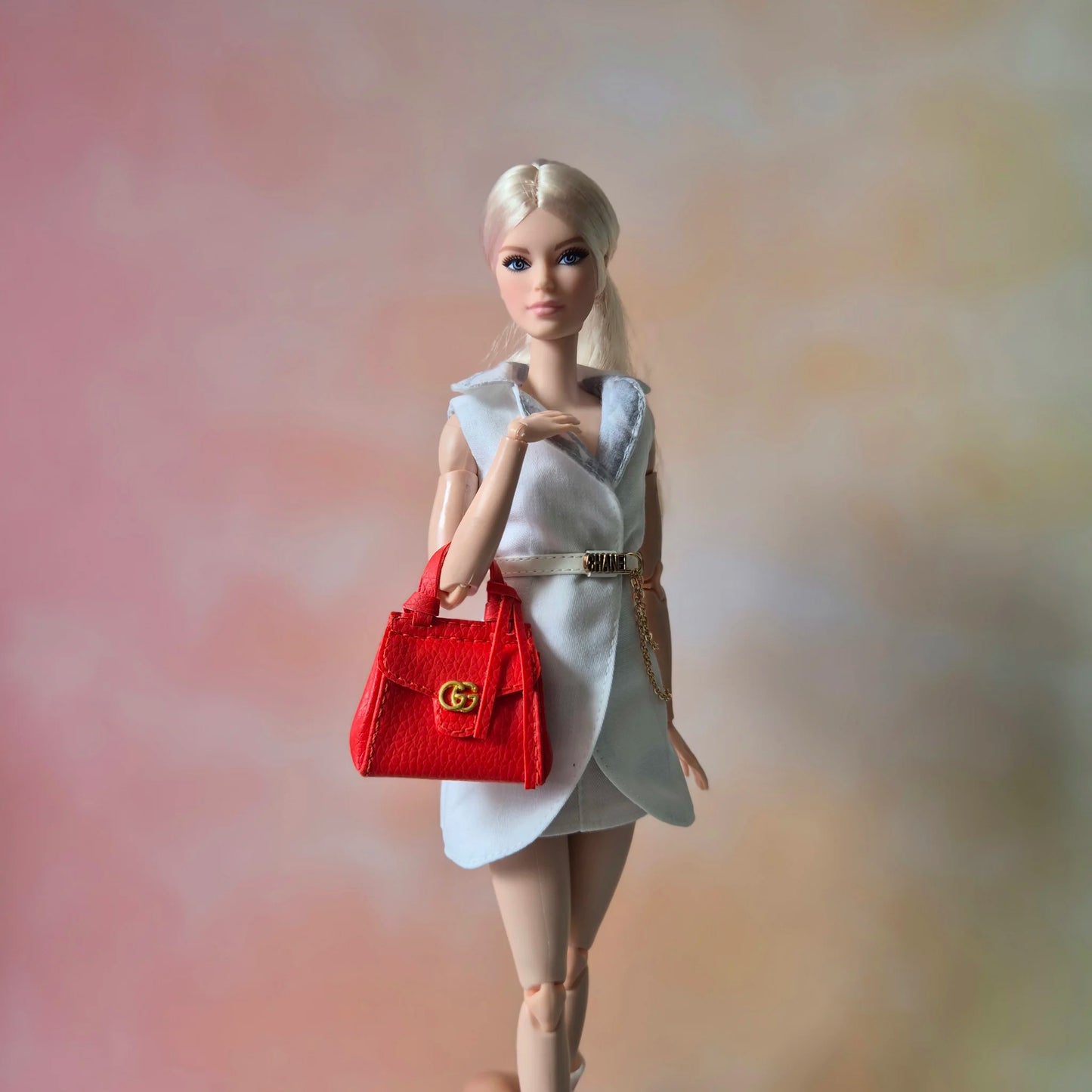 Barbie wear blazer , white pant and red handbag