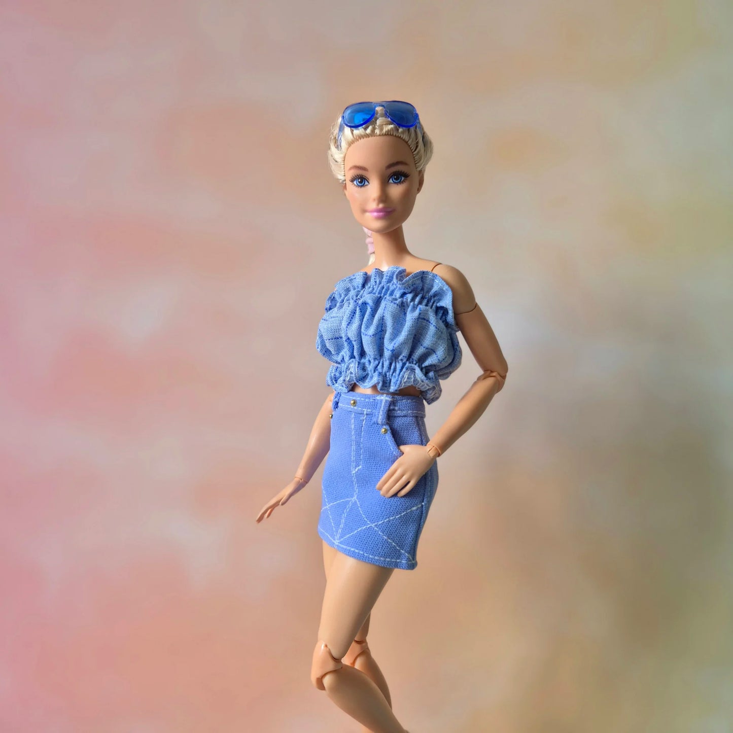 White top and blue skirt for barbie doll