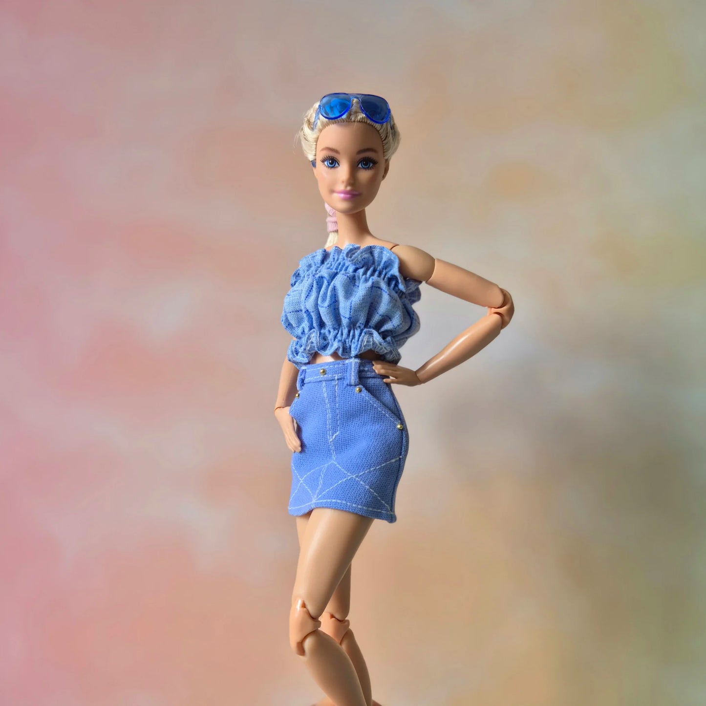 White top and blue skirt for barbie doll