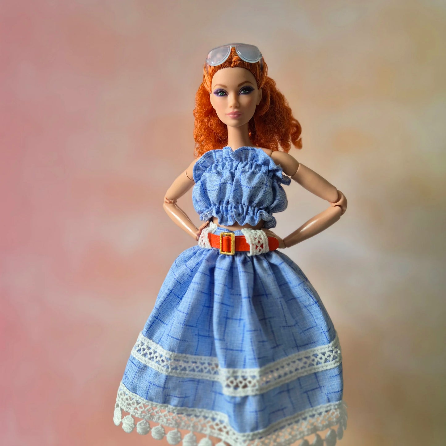 White top and blue skirt for barbie doll