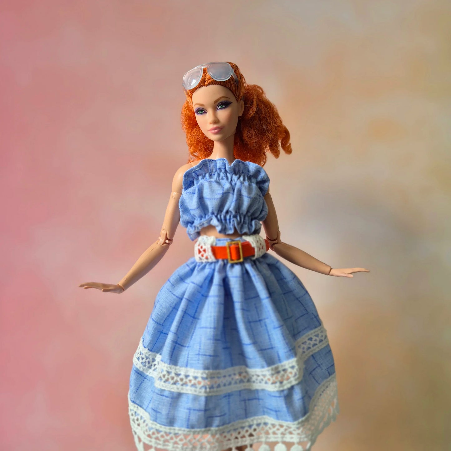 White top and blue skirt for barbie doll