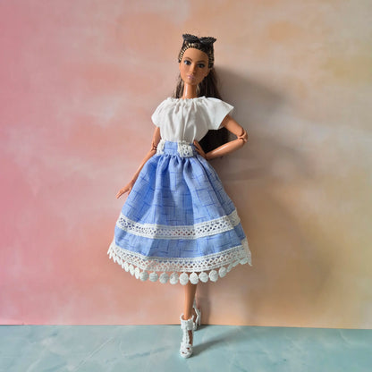 White top and blue skirt for barbie doll