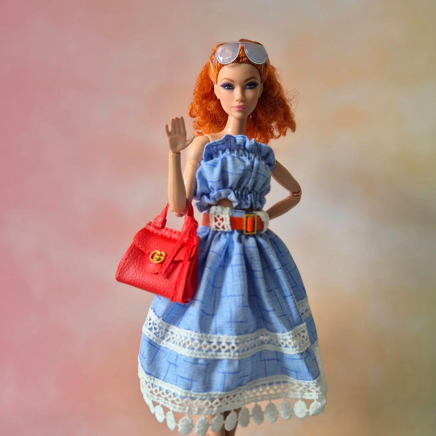 White top and blue skirt for barbie doll