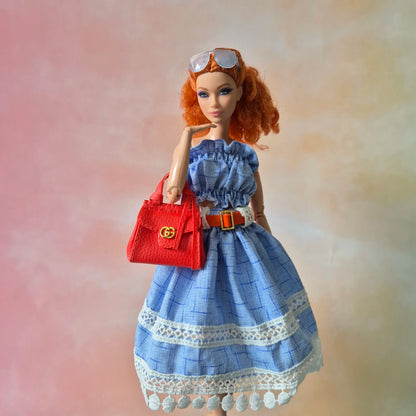 White top and blue skirt for barbie doll