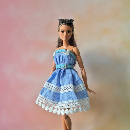 White top and blue skirt for barbie doll