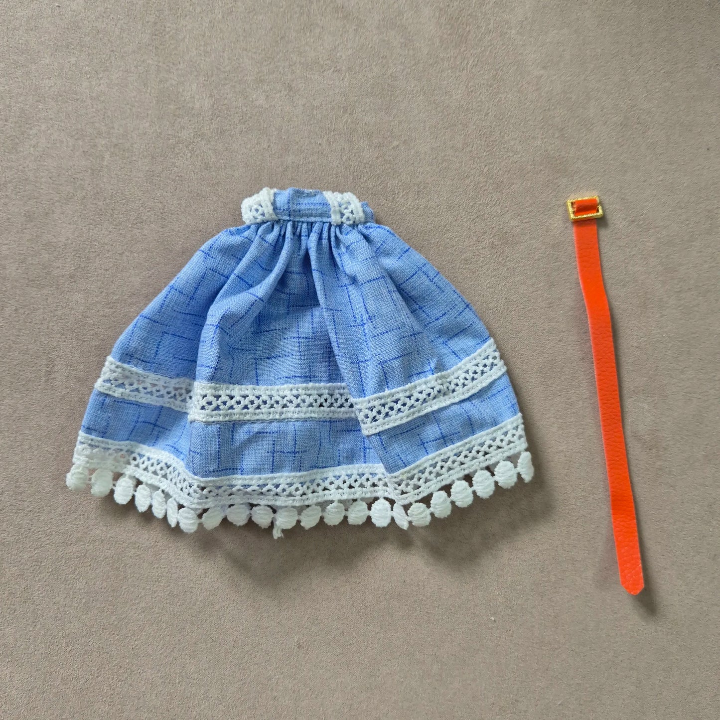 White top and blue skirt for barbie doll