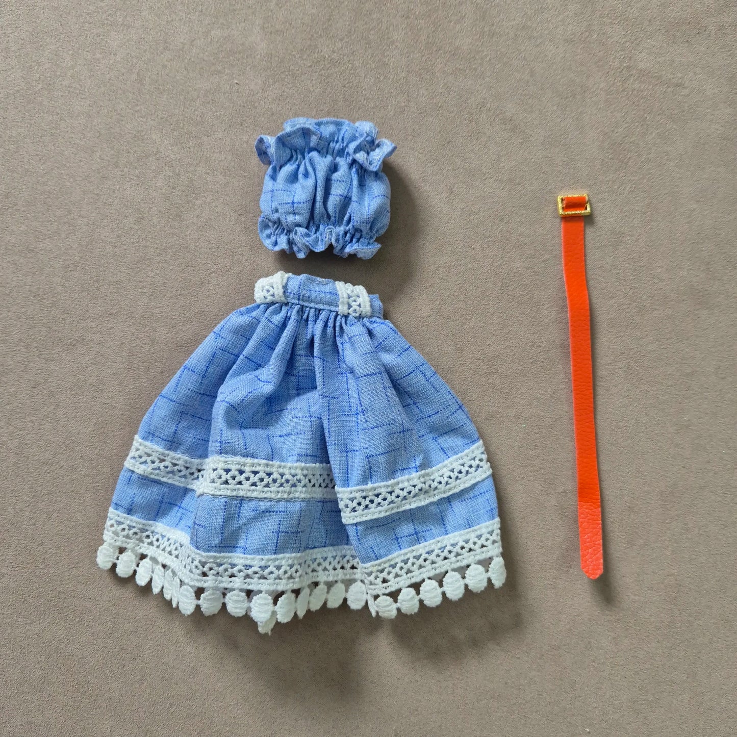 White top and blue skirt for barbie doll