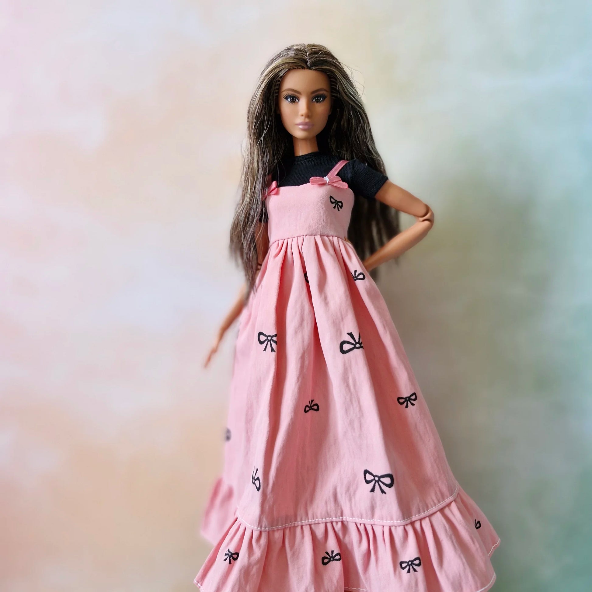 Barbie wearing black top and pink bow maxi dress – doll fashion outfit set
