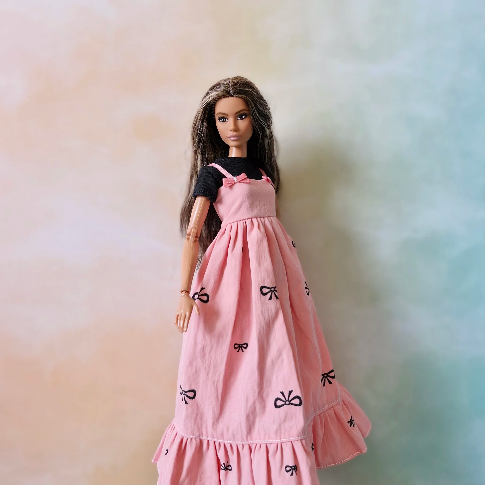 Barbie wearing black top and pink bow maxi dress – doll fashion outfit set