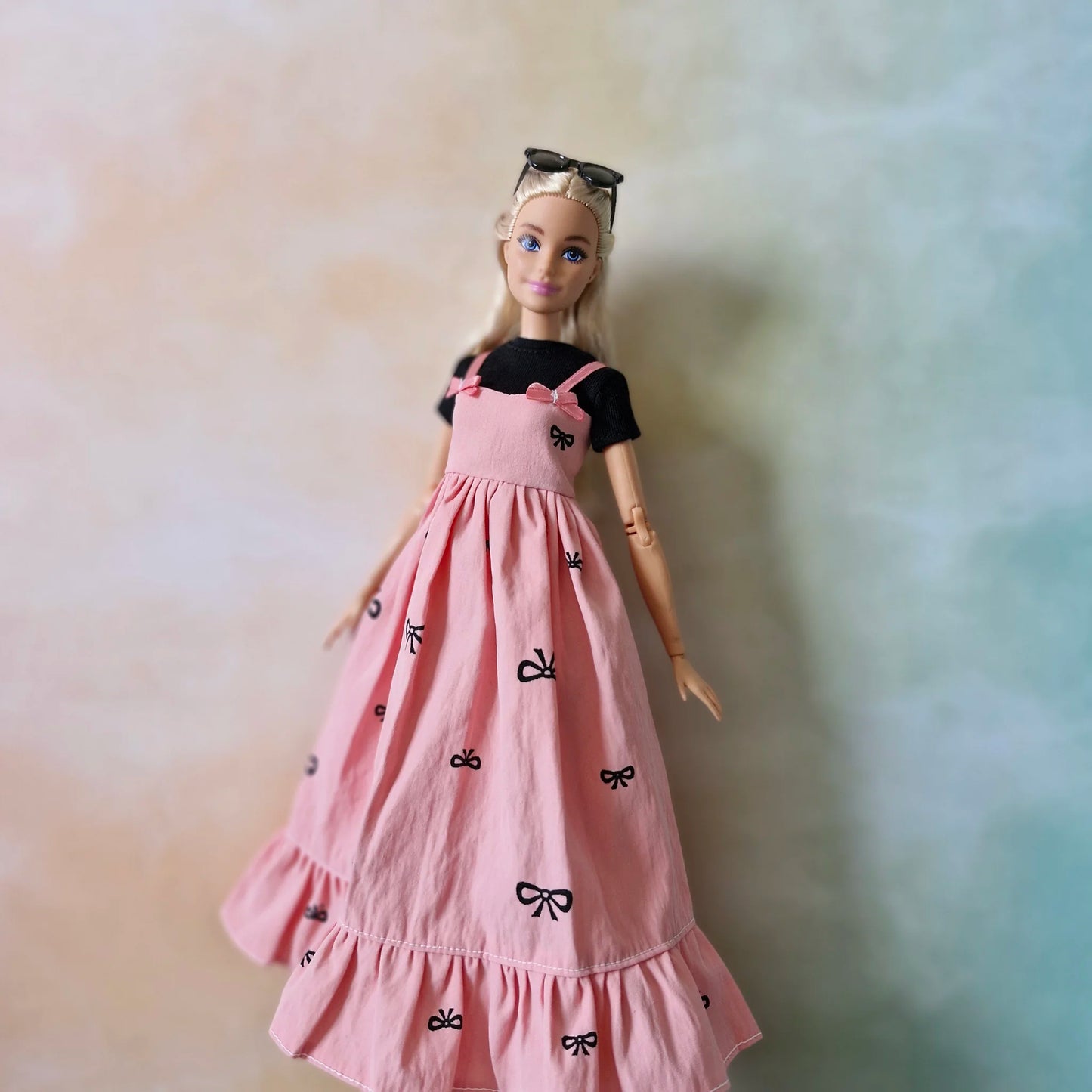 Barbie wearing black top and pink bow maxi dress – doll fashion outfit set