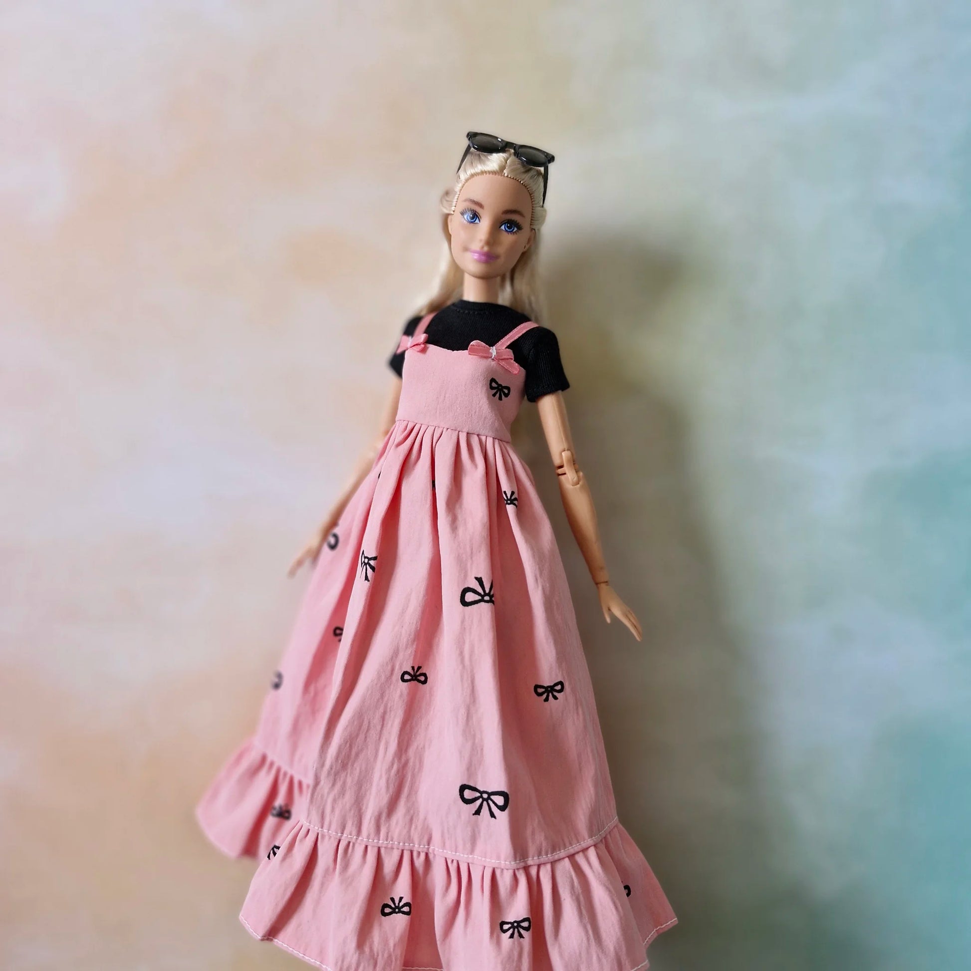 Barbie wearing black top and pink bow maxi dress – doll fashion outfit set
