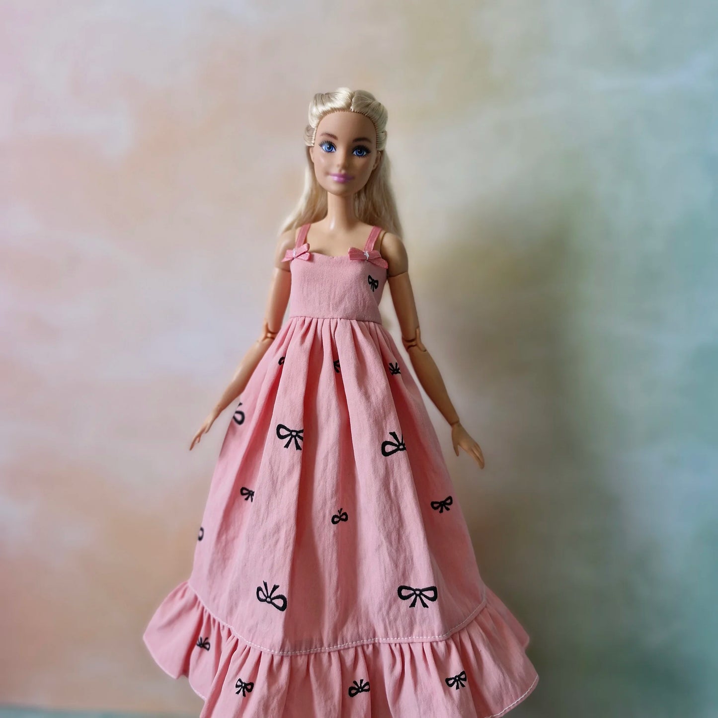 Barbie doll in pink bow dress – stylish dress for Barbie with black t-shirt underneath