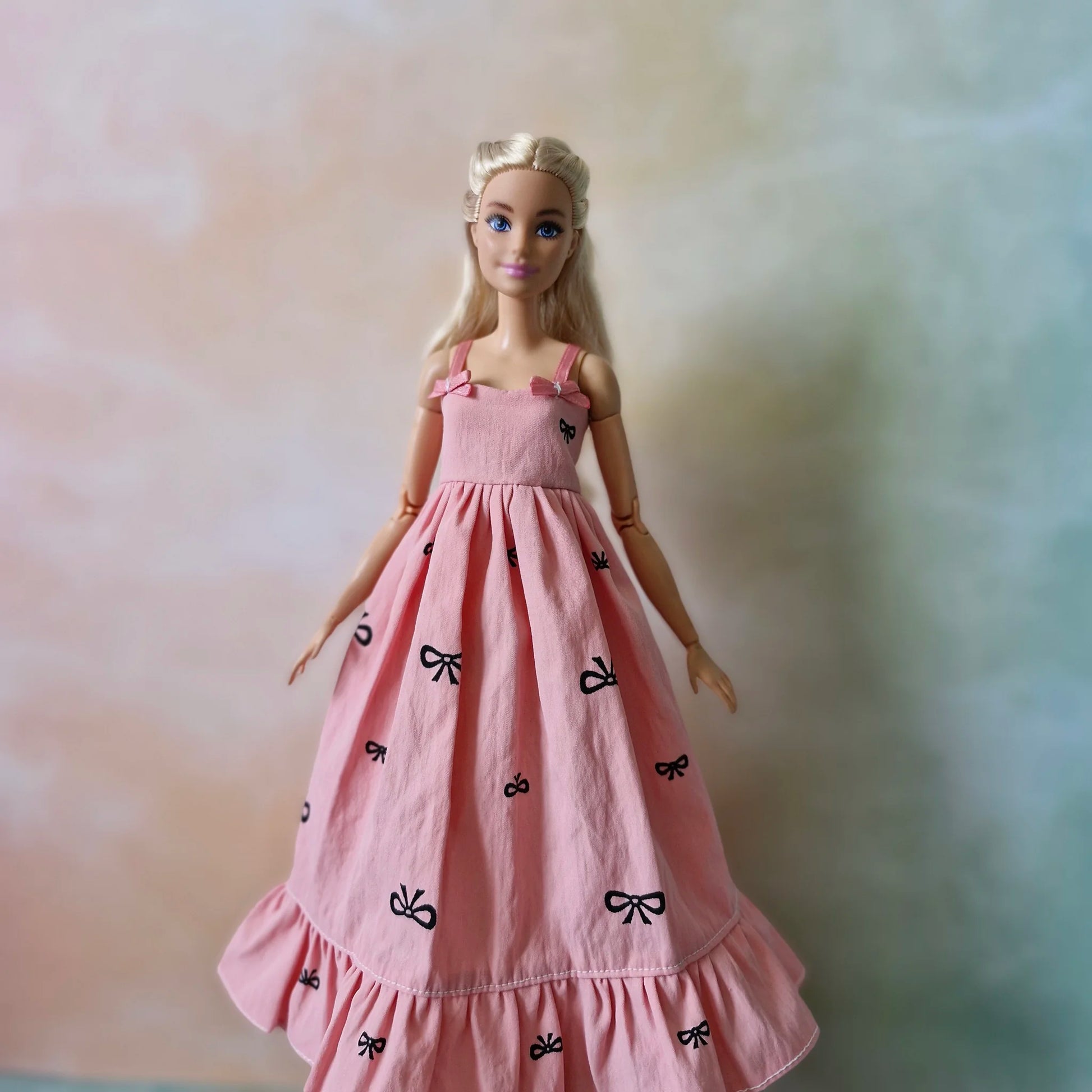 Barbie doll in pink bow dress – stylish dress for Barbie with black t-shirt underneath