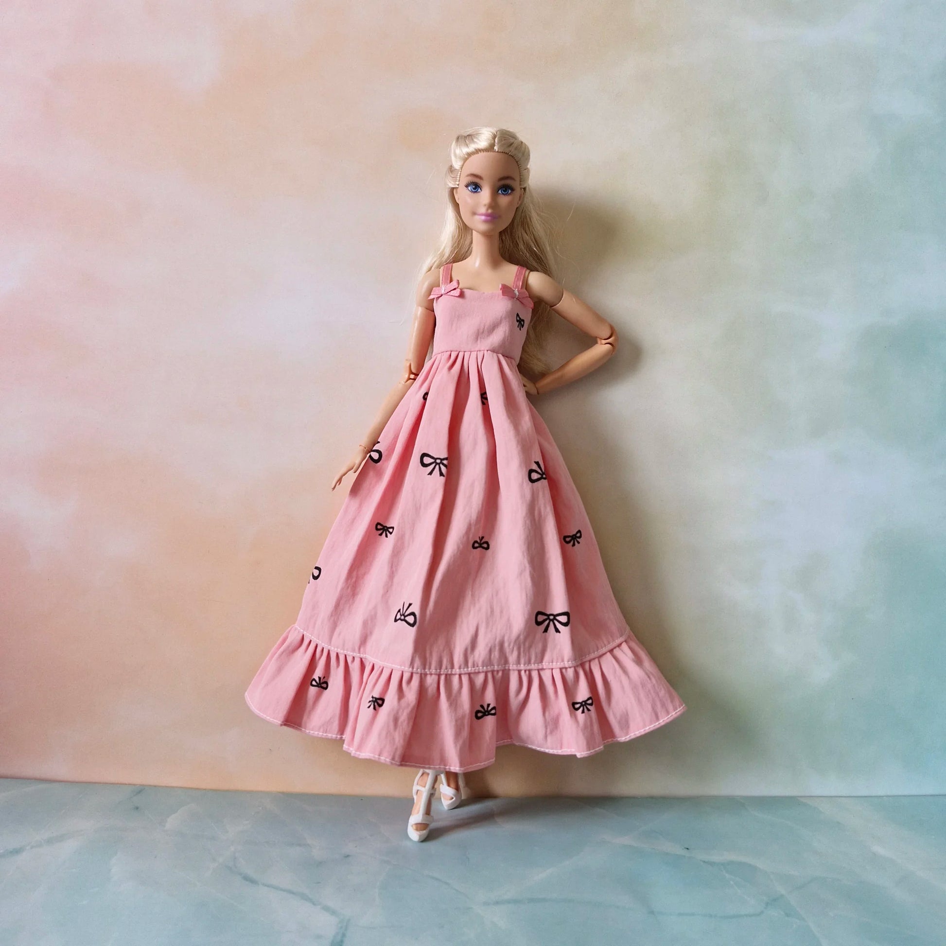 Barbie doll in pink bow dress – stylish dress for Barbie with black t-shirt underneath