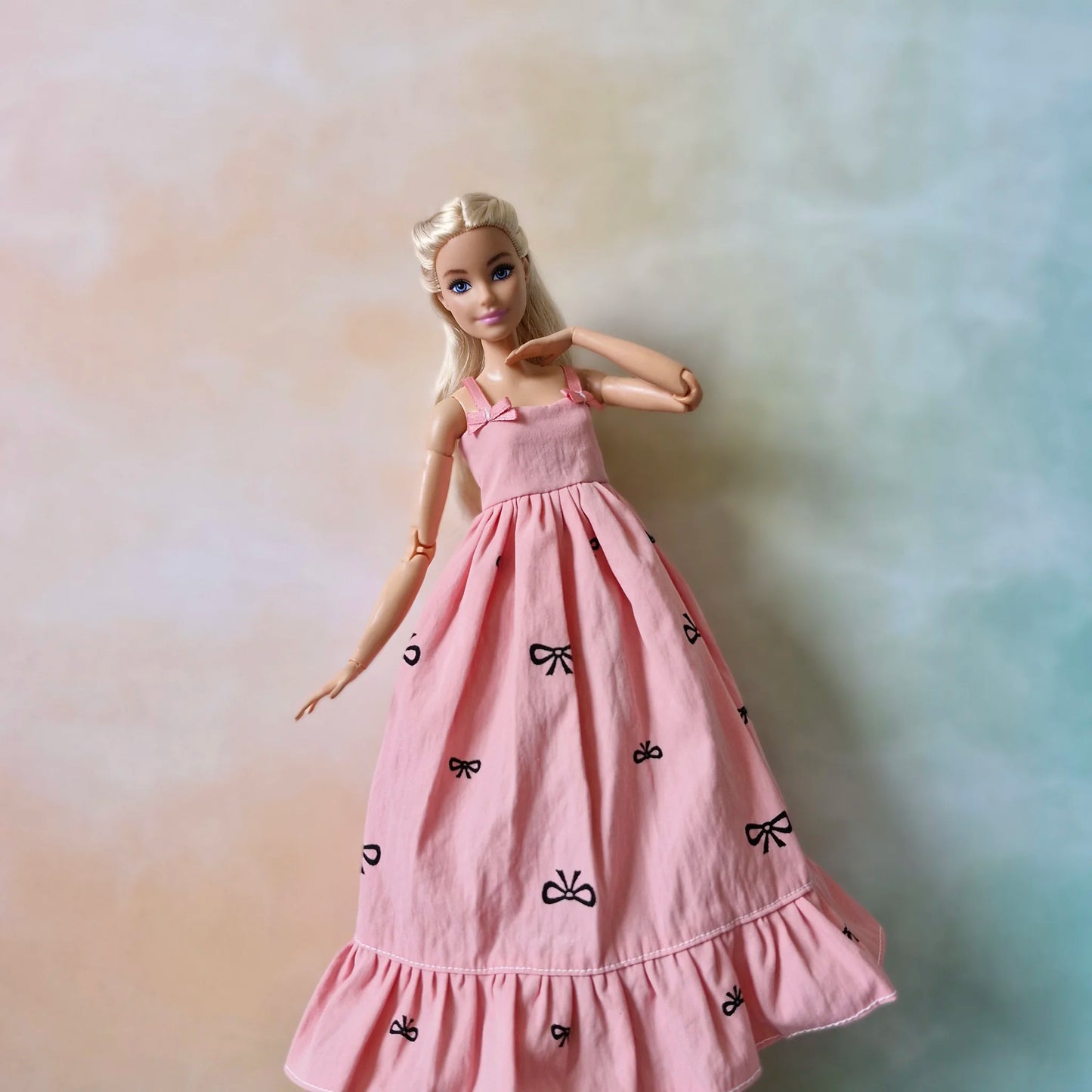 Barbie doll in pink bow dress – stylish dress for Barbie with black t-shirt underneath