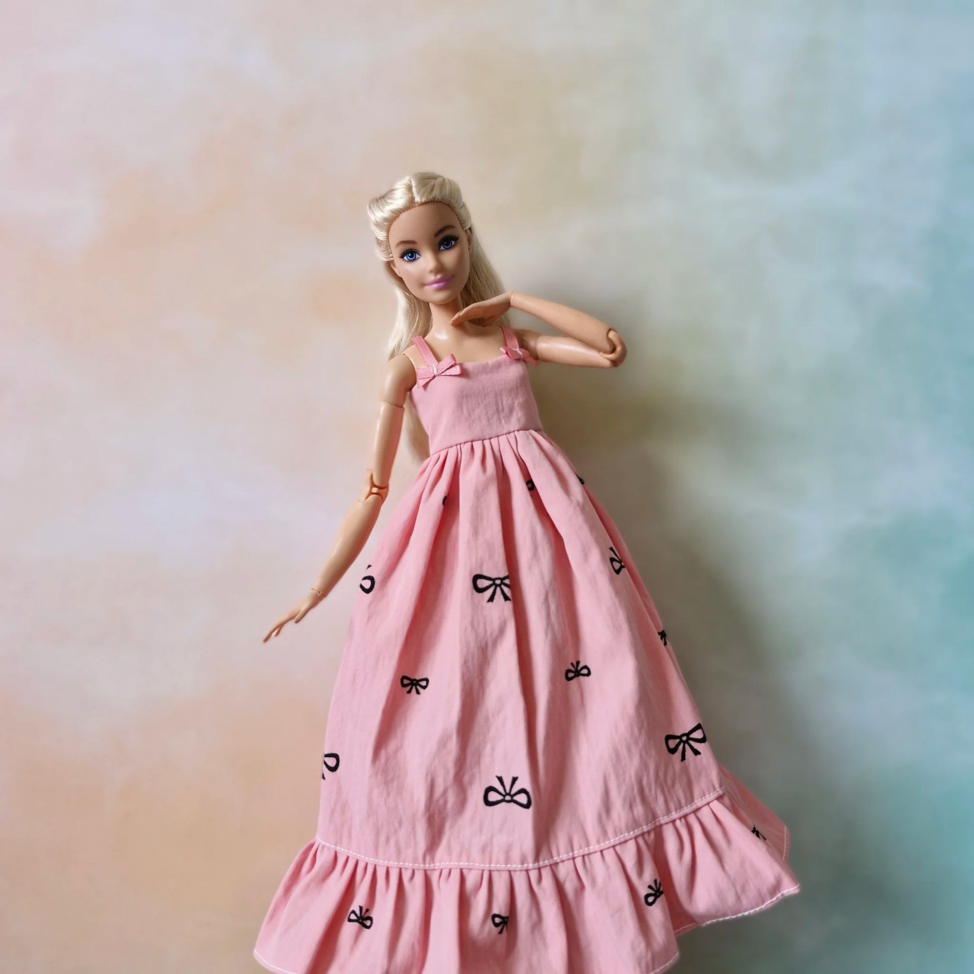Barbie doll in pink bow dress – stylish dress for Barbie with black t-shirt underneath