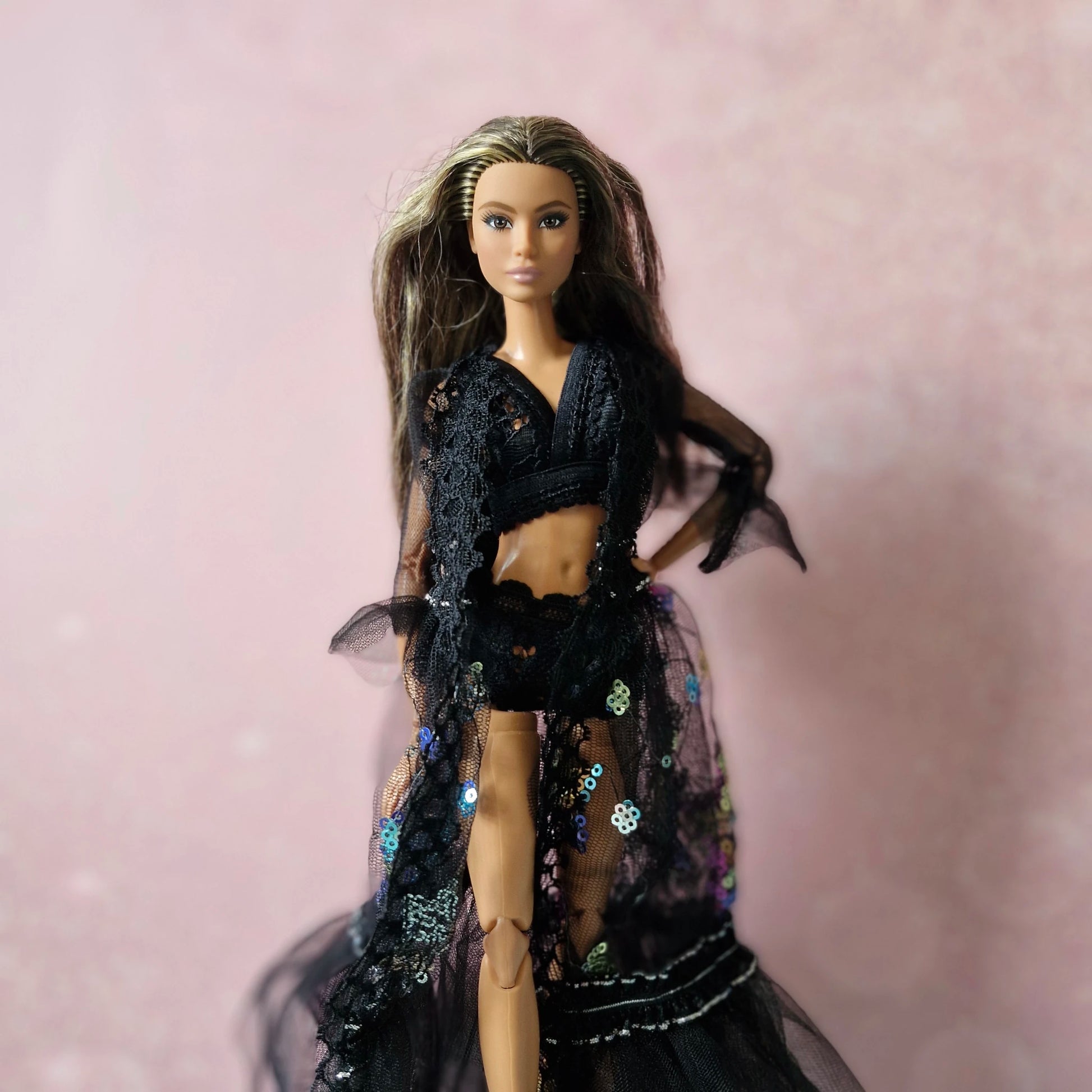 Close-up of brunette Barbie in black sheer sequin and lace robe from the 3-set doll collection.